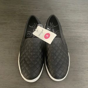 Black slip on sneakers